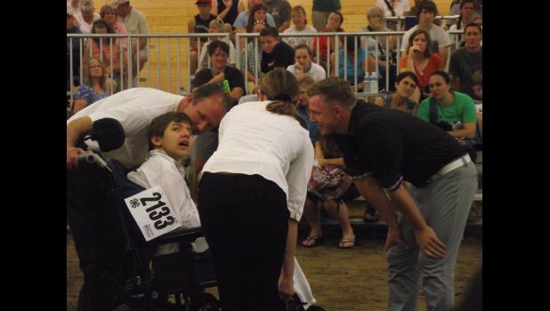 Staff photo by Brittany Moorse. Cody judging dairy goat showmanship at the Minnesota State Fair.