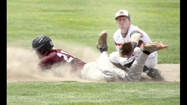 Staff Photo by Byron Higgin Zak Adelman stole second base in the second inning. Beau Buysse was waiting for the ball to arrive.