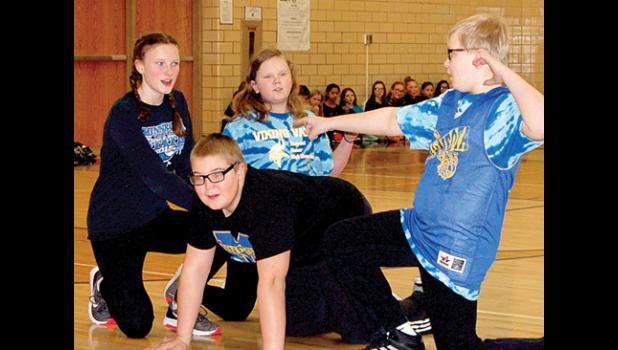 Staff Photo by Cherri Schmig. Sixth Graders were showing what they think is non-peaceful.