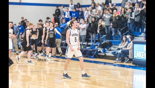 Photo for the Mascot by Brian Jeremiason. Alex Saltzer lets out a victory scream as overtime ends with a Vikings victory.