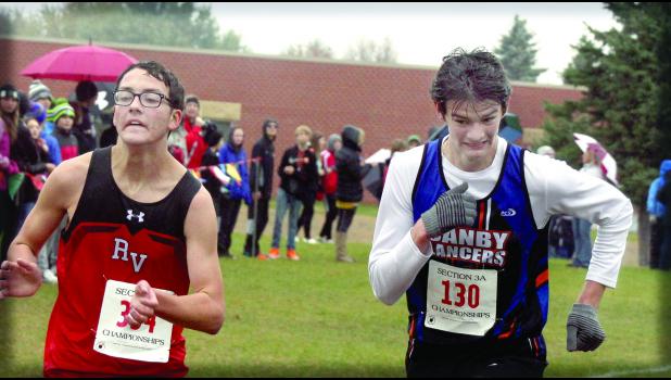Staff Photo by Byron Higgin They came to the finish line and Canby-Minneota's Alexander Full reached deep and passed Sam Fox of Redwood Valley.