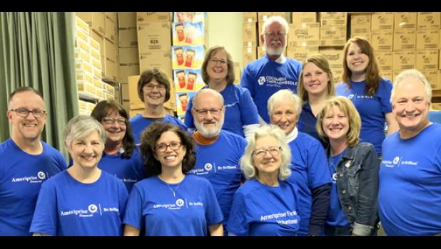 Special photo. Employees from Ameriprise Financial, Van der Hagen, Skogrand and Associates worked together to help fight against hunger.