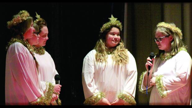 Staff Photo by Byron Higgin Angels Kaci Callens as the Old Star and Old Angel Ella Bot conversed with New Star Reagan Bierschenk and New Angels Sylvia Rabaey and Tara Sterzinger.