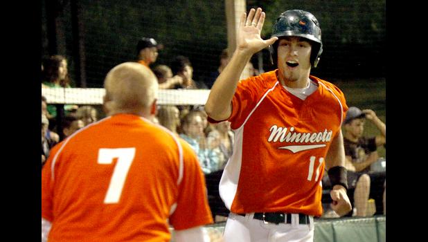 By Byron Higgin, Mascot Sports Editor Austin Buysse gets congratulations from Jesse Drager after he scored a run during the eight-run rally in the eighth inning.