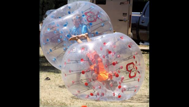 Staff Photo by Byron Higgin. Kids tried the air balloons at the Yellow Medicine County Fair.