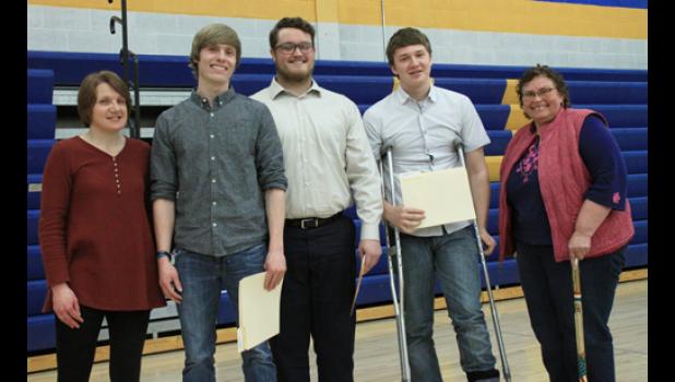 Staff photo by Byron Higgin. The Donny Belaen Scholarships were awarded by Belaen’s wife Deb (left) and sister Rose (right) to (left to right) Skylar Gilbertson, T.J. Esping and Tristan Sorensen.