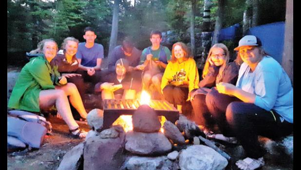 Contributed photo Several members of the group pose around the campfire at their site. Left to right: Lydia Coequyt, Kylee Loyson, Sam Frie, Evan Hennen (sitting on ground), Eli Gruenes, Mark Rabaey, Natalie Bot, Carmen Broers, Ella Moorse.