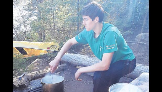 Contributed photo. Mark Rabaey tries his hand at cooking on a campfire.