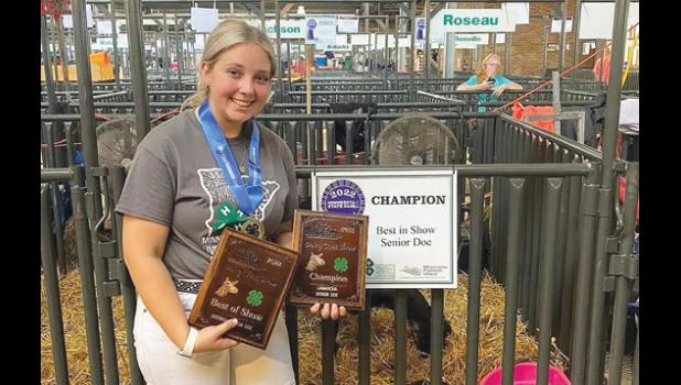 Contributed photo Brooke Moorse achieved a rare "Triple Crown" win at the State Fair on Friday with her dairy goat, Flirtini.
