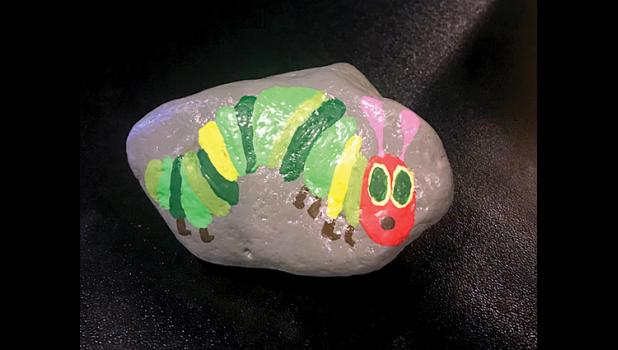 Special Photo. This rock is worth money, if you find it!. Turn it in to KB’s Bar and Grill, have your picture taken and win the cash.