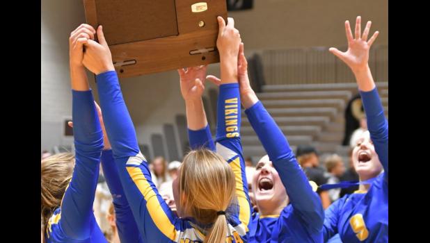 P.hoto for the Mascot by Brian Jeremiason MINNEOTA CELEBRATED THE SECTION TITLE BY HOISTING THEIR TROPHY.