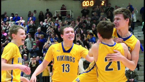 Staff Photo by Byron Higgin When Jacob Hennen's last-second shot fell it for a Minneota Viking victory, he was hoisted by Isaac Hennen as Jarod Josephson and Logan Sussner (13) joined the celebration.