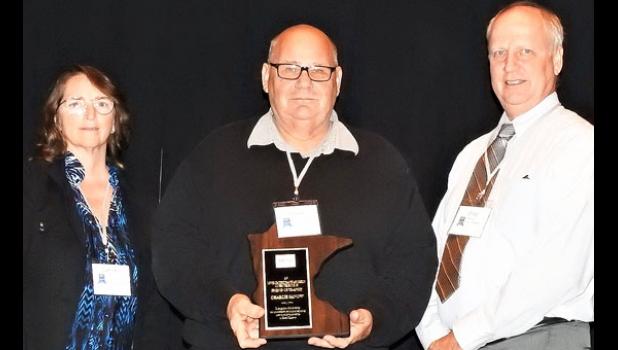Special photo. Receiving his award was Commissioner Sanow (center), UCAP Transportation Director Cathleen Amick (left) and MPTA President Craig Remp.