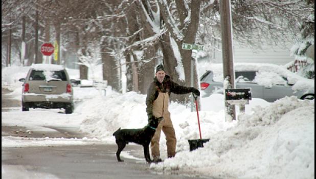 Staff photo by Byron Higgin. Even Coach Chad Johnston, who has finally been freed from Football and Girls' Basketball duties after great runs this year, had to take the shovel in hand at least one more time as he freed his home from the wintery blast.