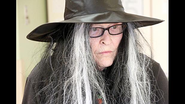 Staff Photo by Byron Higgin. Doing her part by playing a witch was Corky DeCock.