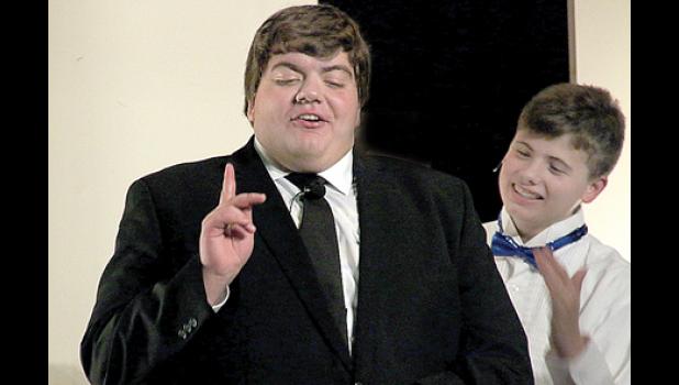 Staff Photo by Byron Higgin. Daddy Warbucks is played by Zach Van Keulen. Here he makes a point to a member of his staff, Drake, played by Jackson Jeremiason. The young cast will bring this musical to life this weekend.