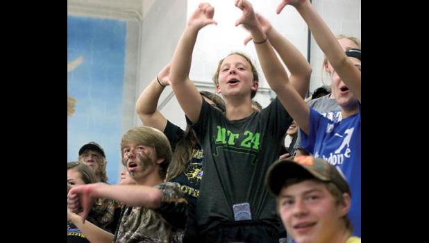 Staff Photo by Byron Higgin. A big part of the victory were the camouflaged Minneota fans, who kept up cheering their team the entire time. Here the fans were reacting to the Canby fans inability to return a cheer during a chant.