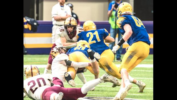 Mascot photo by Brian Jeremiason Lucas Rybinski (10) dives for yardage in the second half against Springfield.