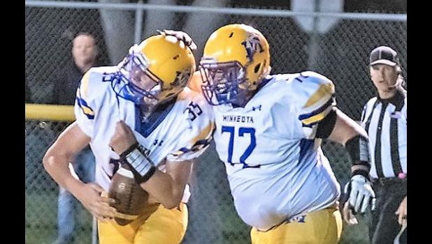 Mascot photo by Brian Jeremiason Sawyer DeSmet, left, is congratulated by his older brother, Landon DeSmet, after catching his first touchdown pass on varsity.