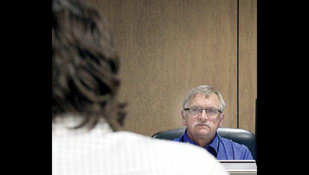 Commissioner Gary Crowley listened as County Engineer Aaron VanMoer explains the parking stall proposals for the government center. 
