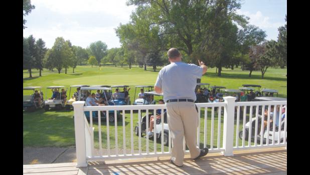 Mascot photo by Scott Thoma Countryside Golf Club General Manager Tony Esping explains the rules of the new Junior Golf League last Thursday to 60 kids that signed up.