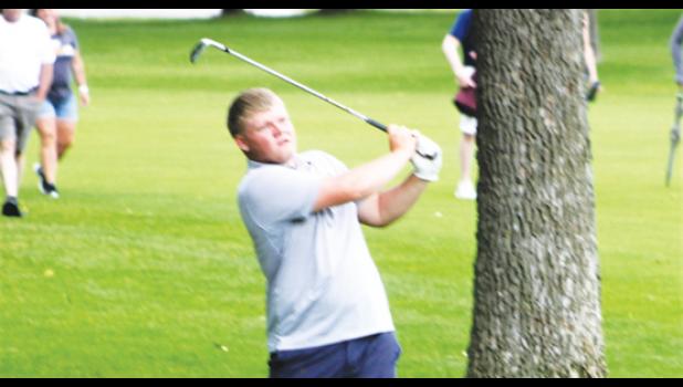 Mascot photo by Scott Thoma Cole Myhre hits an iron shot on hole No. 16 during Wednesday's state tournament in Becker.