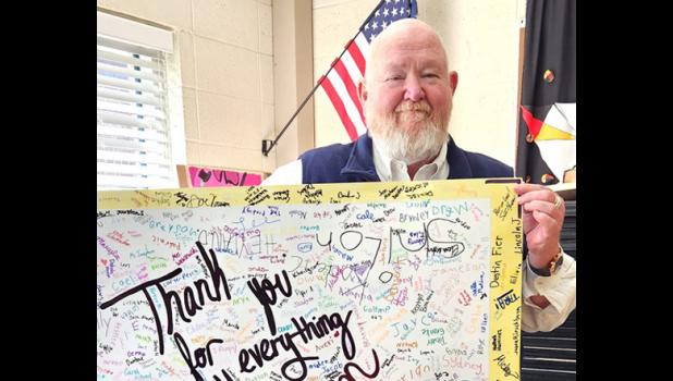 Contributed photo Scott Hanson was given a poster signed by his students as a retirement gift.