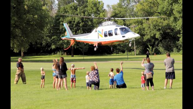 Photo for The Mascot by Laura Buysse. Whether getting wet, walking the sobriety line, soaking each other or waving to the emergency helicopter, kids were having fun at National Night Out Tuesday in Minneota.