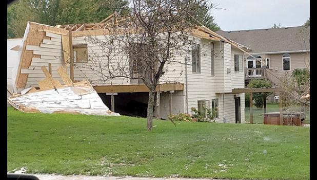 Special photo by Tara Moen. Many homes in the Sioux Falls area were damaged by last Tuesday night’s storm. This is one of them. Many more were worse and there was a lot of commercial damage as well.