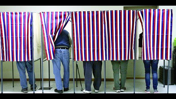 Staff Photo by Byron Higgin Minneota voting booths were filled with voters pretty much all day.
