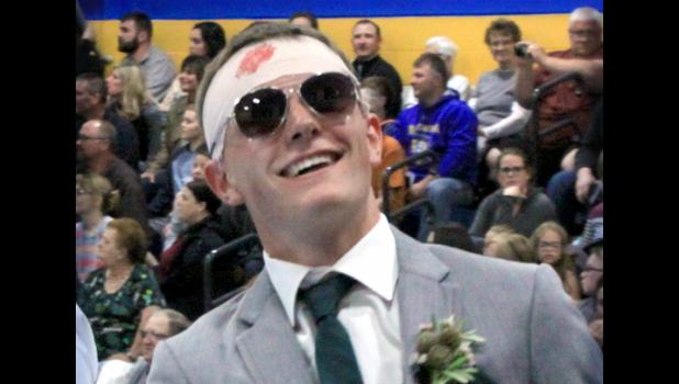 Staff Photo by Byron Higgin. Jared Josephson clowned around with Nelson’s crutches during the fun time of the prom.