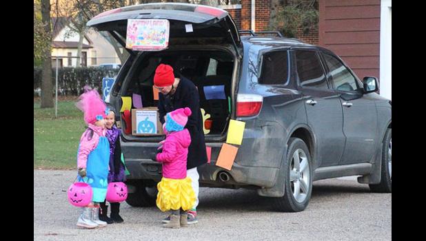 File photo. Jenny Buysse handed out candy from her "Candyland" trunk.