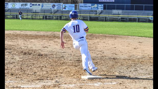 Photo for the Mascot by Brian Jeremiason. Josh Laleman rounds first base after rocketing a double to left centerfield.