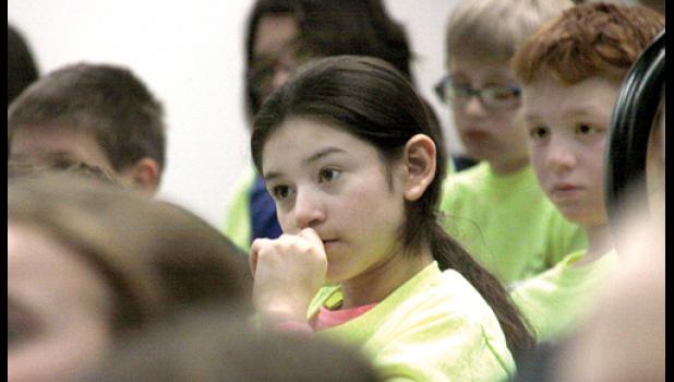Staff Photo by Byron Higgin. Listening intently to Gene Stengel’s message on farm safety was Laisha Towns.