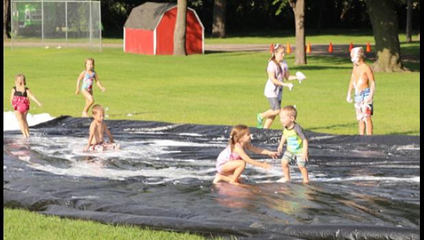 Photo for The Mascot by Laura Buysse. Whether getting wet, walking the sobriety line, soaking each other or waving to the emergency helicopter, kids were having fun at National Night Out Tuesday in Minneota.