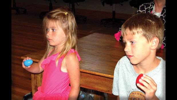 Staff photo by Hannah Buysse. Layla and Wyatt Opdahl played the egg shakers in The Monkey Speaks His Mind. Getting the kids involved is an excellent way to teach the music to the younger generation.