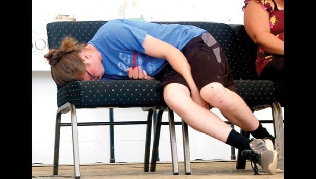 Staff Photo by Scott Thoma. The different reactions of Brenden Kimpe after being hypnotized on Saturday.