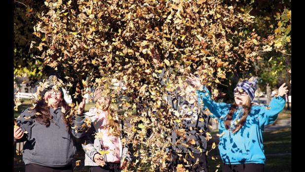 Staff Photo by Byron Higgin. So the leaves went into the air as the girls had a good time. They were: (left to right) Madison Lozenski, Tara Sterzinger, Lyssa Kremin (hidden by leaves), Jadyn Krier and Mckenna Moorse.