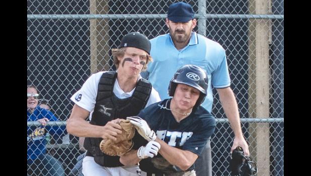 Mascot photo by Brian Jeremiason. Minneota catcher A.J. Myhre holds onto the ball and tags out an RTR runner to keep the game scoreless.