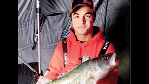 Special Photo. Leo Buysse with one of his large catches inside his fish house.