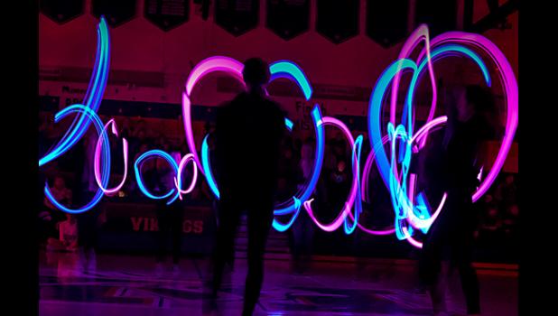 Photo for the Mascot by Brian Jeremiason. The lights were shut down and the dancers performed, much to the delight of the crowd.