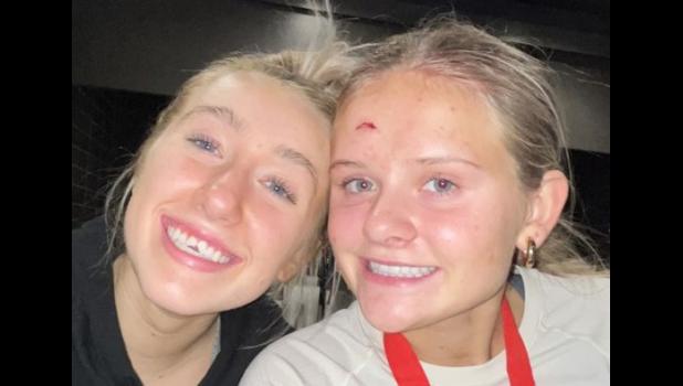 Contributed photo Southwest Minnesota Christian basketball players Madyson Fey, left, and Ana Veldkamp were injured late in the Section 3A championship game against Minneota on March 11. Fey lost pieces of both of her front teeth when they cut into Veldkamp’s forehead.