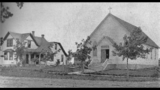 Contributed photo This is a photo of the original St. Edward Catholic Church and Rectory built in 1881. Father Louis Carnelus was appointed Pastor in August of that year and immediately started to build the first church and Parish house that fall. The church, built on borrowed money, cost $900.