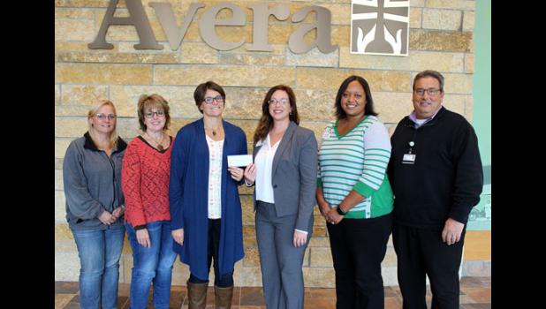 Special photo. Pictured are: (left to right) Christy Lundberg, Carol Oakland and Eriann Faris presenting a check to Abby Ennenga, Avera Marshall Foundation; and Denae Winter and Dr. William Del Monte, Avera Marshall Behavioral Health Services.
