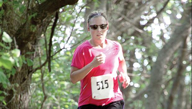 Staff Photo by Byron Higgin. Molly Knutson of Volga, SD finished second overall and first in the women’s division of the Porter Harvest Fest race last weekend in Porter.