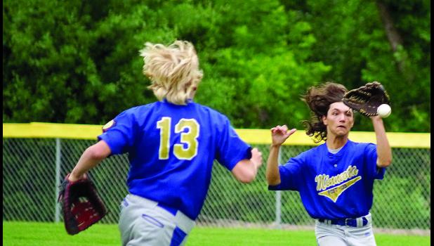Photo for the Mascot by Sue Jacobson. Right fielder Jaymes Moon came in to make a catch from right field. First baseman Austin Sorensen (left) went out to help.