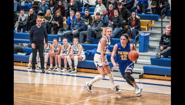 Photo for the Mascot by Brian Jeremiason. Natalee Rolbiecki drives the baseline against CMCS' Reegan Duininck.