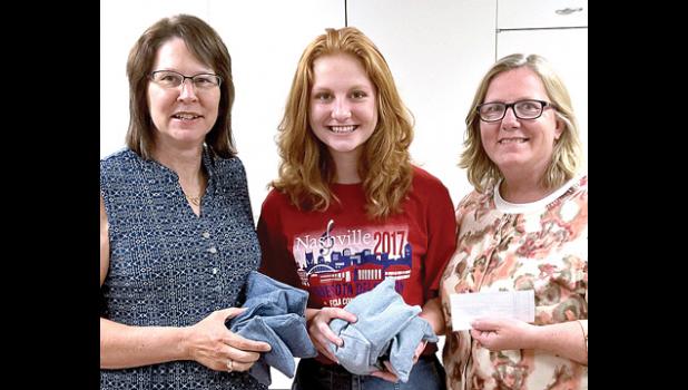 Special Photo. Dawn Van Keulen from the Bug Days Committee presents a check to Natalie and LeaAnne Bot.