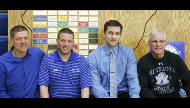 Staff Photo by Byron Higgin. J.D. Pesch got the honor of naming four new members to the Wally Pesch Wall of Fame.Three of the members were present Sunday at the annual Wrestling Banquet. Along with Pesch (left), were Bruce Laleman, Josh VanOverbeke and Dennis Stoks.