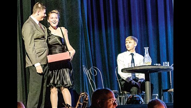 Photo for the Mascot by Brian Jeremiason. Jackson Jeremiason puts the moves on cigarette girl Reese Gillund as Jacob Haen looked on.
